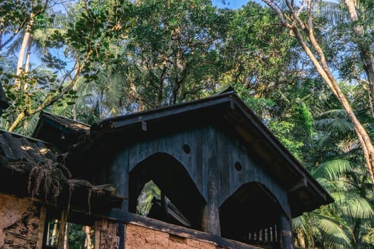 Old abandoned wooden house, in the Jardim Botanic Garden in São Paulo, Brazil.
