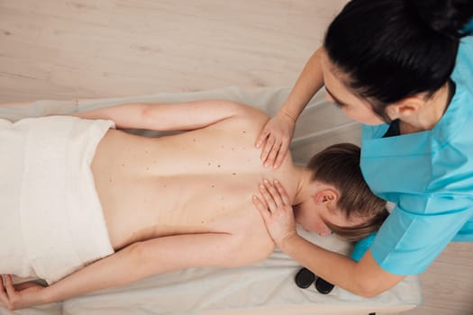 back massage in the office crepatura osteopathy relaxation stones