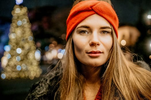 Winter fun on the street: Girl with sparklers, smiles in warm jacket and hat. Festive Christmas or New Year celebration,