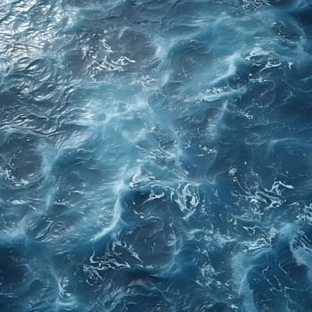 Abstract image of ocean waves with a blue color, showing the surface of the water with some white foam and light reflections.