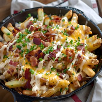 A close-up view of a plate of bacon cheeseburger loaded fries. The fries are piled high and topped with crispy bacon, melted cheese, and a creamy sauce.
