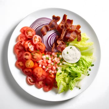 A fresh and delicious salad with red onion, tomatoes, lettuce, bacon and a side of ranch dressing. The ingredients are arranged in a circular pattern on a white plate.