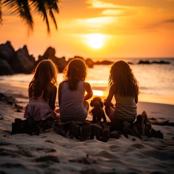 Three girls are sitting on a beach watching the sunset, with their dog beside them. The image is taken from a low angle, showcasing the golden light of the sunset reflecting on the water