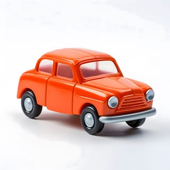 A close-up shot of a bright orange toy car on a white background. The car is a small, plastic model of a classic car.