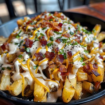Close up of a plate of french fries topped with bacon, cheese, and ranch dressing.