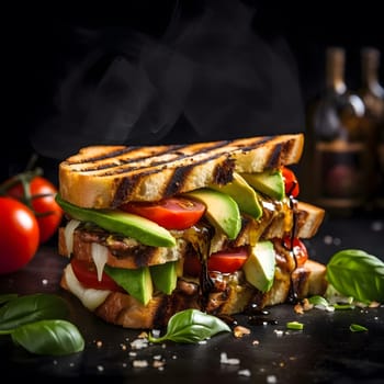 A close-up shot of a grilled avocado sandwich with tomato and basil, the sandwich is steaming, there are tomatoes in the background and basil on the foreground