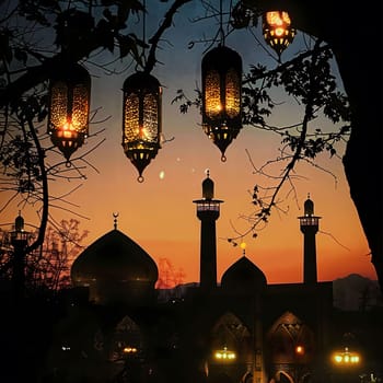 A silhouette of a mosque against a vibrant sunset sky with glowing lanterns.
