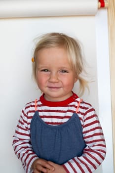Beautiful happy caucasian toddler child girl smiling, portrait neutral background High quality photo