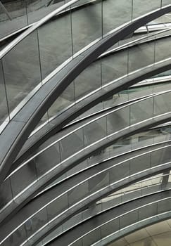 Berlin, Germany - Dec 20, 2023 - A curved walkway stretches in spirals upwards on top inside the glass dome constructed of the Reichstag building. Contemporary architecture of the Cupola of the Reichstag dome, a major tourist attraction of the berlin city, Space for text, Selective focus.