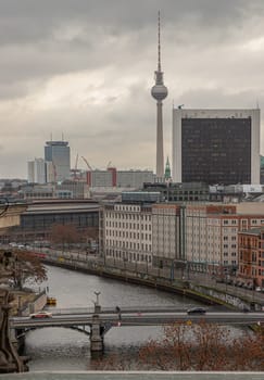 Berlin, Germany - Dec 20, 2023 - Berlin cityscape view from above of Reichstag building with Berlin TV-Tower, Berliner Dom, Marschall Bridge, River Spree and buildings at the downtown Berlin. a major tourist attraction of the berlin city, Space for text, Selective focus.