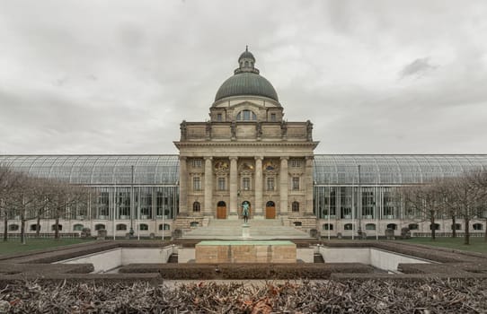 Munich, Germany - Dec 21, 2023 - Architecture exterior of Bayerische Staatskanzlei is a government building with Monument in front of entrance. Bavarian State Chancellery building (the former Bayerische Armeemuseum, Bavarian Army museum), Copy space, Selective focus.