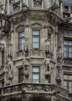 Munich, Germany - Dec 21, 2023 - Exterior architecture design details of famous New Town Hall (Neue Rathaus) on Marienplatz square in Munich. Gothic architectural style. Space for text, Selective focus.