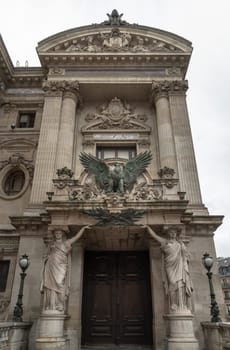 France, Paris - Jan 04, 2024 - Entrance to the opera house Palais Garnier with caryatids. Architectural details of The Palais Garnier (Opera National de Paris). Place de l'Opéra (Opera Garnier) is famous Neo-baroque building in Paris, UNESCO World Heritage Site, Space for text, Selective focus.