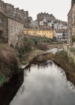 Edinburgh, Scotland - Jan 16, 2024 - Picturesque of Dean village with river and stream which sits along the banks of the Water of Leith. Space for text, Selective focus.