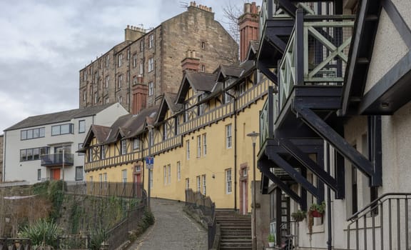 Edinburgh, Scotland - Jan 16, 2024 - Hawthorn Buildings is a traditional old Tenement building on Hawthornbank Lane in Dean Village with river and stream which sits along the banks of the Water of Leith. Space for text, Selective focus.