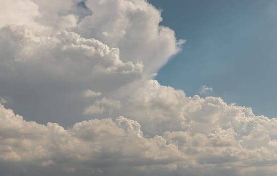 The sky is being covered with fluffy white clouds. Concept idea of Imaginative clouds nature, Amazing sky like a heaven for background wallpaper and texture, Space for text, Selective Focus.