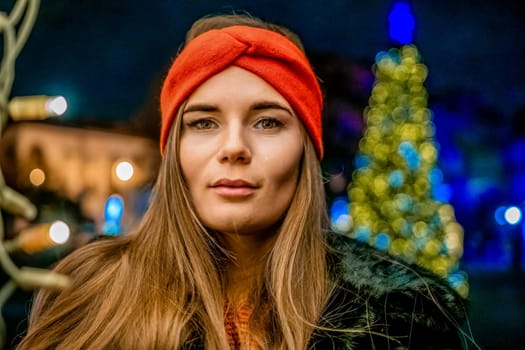 Winter fun on the street: Girl with sparklers, smiles in warm jacket and hat. Festive Christmas or New Year celebration,