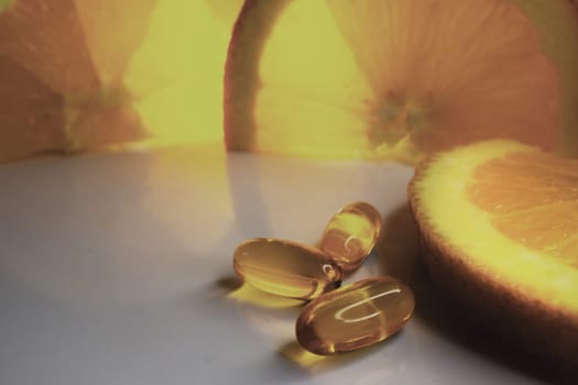 Ascorbic acid. Oranges background. Banner for suplements promotion. Health care concept