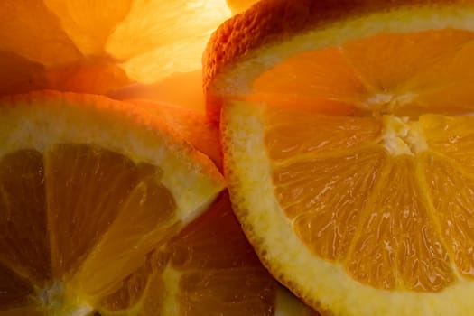 Background with fresh and natural oranges. Backlighting. Wallpaper for products.