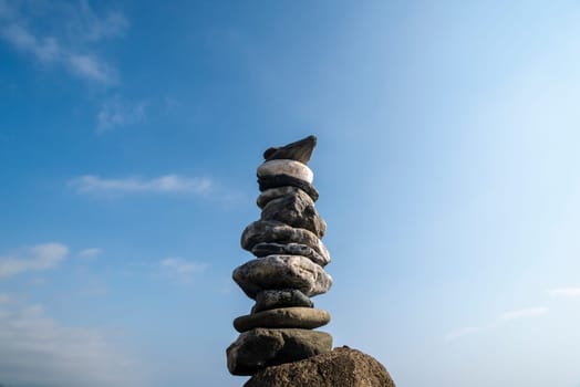 balanced stones on the rocks of the sea