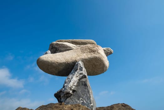 balanced stones on the rocks of the sea