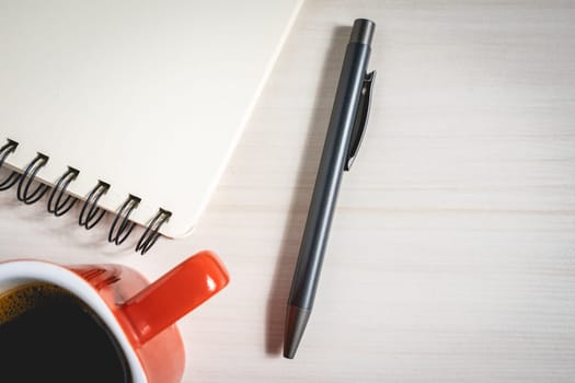 A pen A notebook and a cup of coffee. Background for ideas or inspiration.