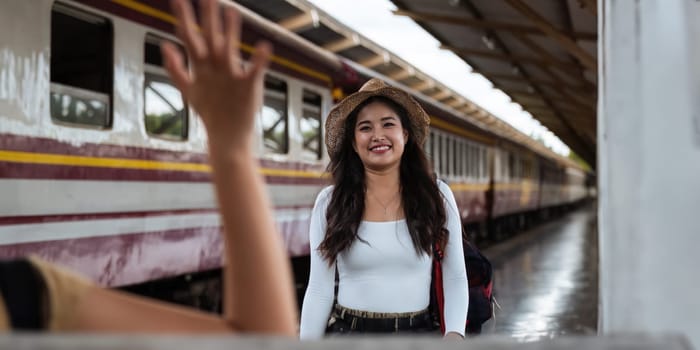 female tourist go on a traveling meet friend trip walking with luggage at train station. concept transport lifestyle active journey and travel adventure.