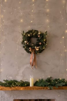 Home New Year's kitchen interior. Decorations with garlands and a Christmas wreath. Cozy atmosphere of a home holiday, loft-style interior design,