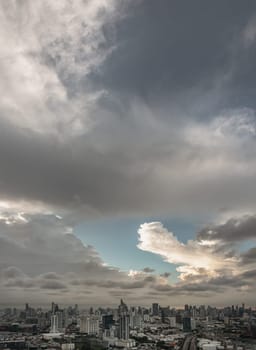 Bangkok, Thailand - 04 Aug 2024 - Beautiful Clouds in the Sky over Large Metropolitan City of Bangkok. View of Skyscrapers and Dramatic Sky before Sunset, Space for text, Selective focus.