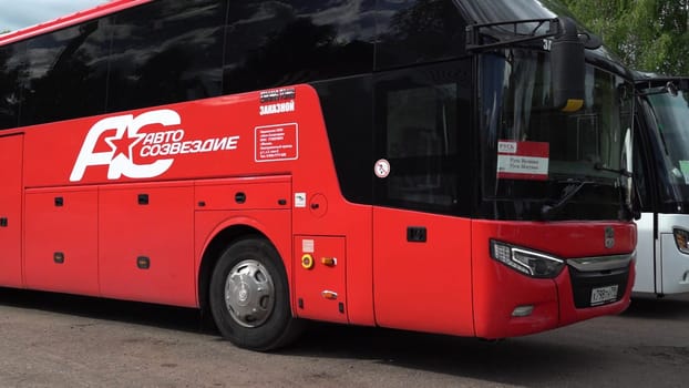 Russia, Pskov region, July 20, 2024 - A A close look at a red passenger bus parked in the station.