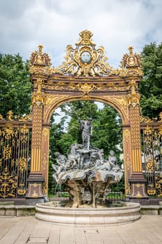 Gates and fountains in Stanislas Place - Nancy - France. One of the ornate gates and fountains in Stanislas Place in the historic center of the city of Nancy in France. A UNESCO World Heritage Site