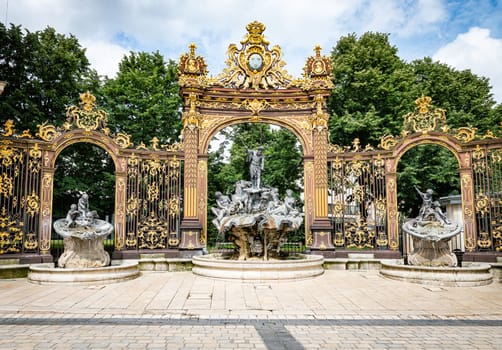 Gates and fountains in Stanislas Place - Nancy - France. One of the ornate gates and fountains in Stanislas Place in the historic center of the city of Nancy in France. A UNESCO World Heritage Site