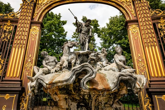 Gates and fountains in Stanislas Place - Nancy - France. One of the ornate gates and fountains in Stanislas Place in the historic center of the city of Nancy in France. A UNESCO World Heritage Site
