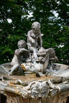 detail of fountains in Stanislas Place - Nancy - France. One of the ornate gates and fountains in Stanislas Place in the historic center of the city of Nancy in France. A UNESCO World Heritage Site