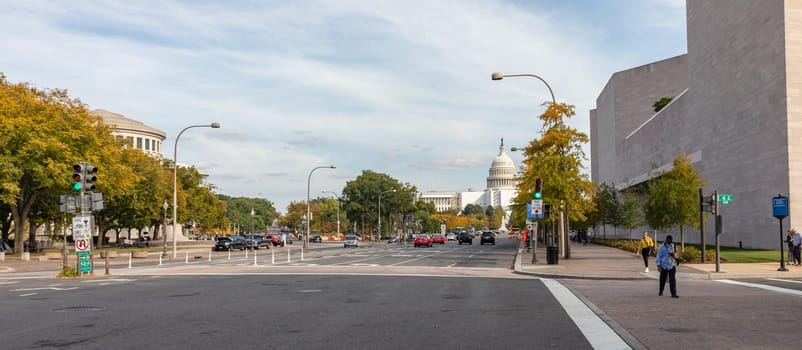 Washington DC, USA - Oct. 12, 2022: Busy street in Washington D.C., with contemporary architecture and people walking.