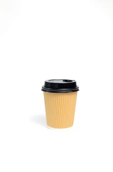 Isolated Mockup Brown Beige Paper Drinks Mug, Cup with Black Lid On White Background. Eco Hot Beverage Tumbler, Vertical Plane, Copy Space. On the Go Food Service Application. High quality photo