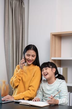 A joyful mother and daughter bonding at home, sharing a moment of laughter and happiness while working on a project together.