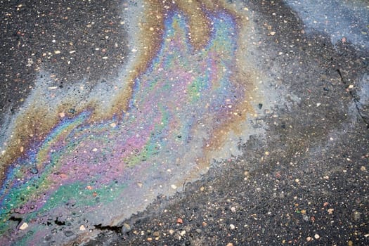 Overhead View of a Vibrant Oil Slick on Wet Asphalt