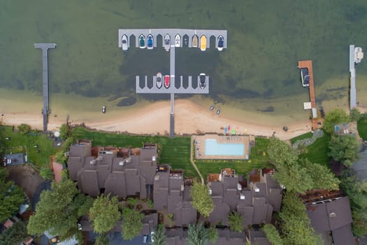 aerial view of a harbor in front of an apartment building