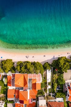 Beautiful Brela on Makarska riviera, Croatia. Adriatic Sea with amazing turquoise clean water and white sand. Aerial view of Brela beach and waterfront on Makarska riviera, Dalmatia region of Croatia.
