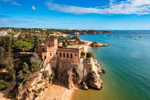 The Fort of Sao Joao do Arade (Castle of Arade) in Ferragudo Village, Algarve. Beach and castle Sao Joao do Arade in Ferragudo in the Algarve in Portugal.