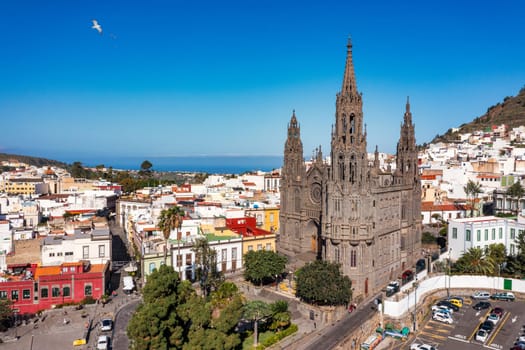 Aerial view of the Parroquia de San Juan Bautista de Arucas church in Arucas town, Gran Canaria, Canary Islands, Spain. Historic Neo-Gothic cathedral in Arucas. 