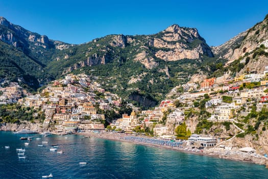 Aerial view of Positano with comfortable beach and blue sea on Amalfi Coast in Campania, Italy. Positano village on the Amalfi Coast, Salerno, Campania. Beautiful Positano, Amalfi Coast in Campania.