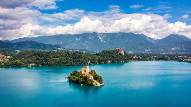 Lake Bled in Slovenia. Beautiful mountains and Bled lake with small Pilgrimage Church. Bled lake and island with Pilgrimage Church of the Assumption of Maria. Bled, Slovenia, Europe.