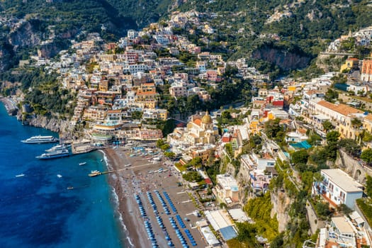 Aerial view of Positano with comfortable beach and blue sea on Amalfi Coast in Campania, Italy. Positano village on the Amalfi Coast, Salerno, Campania. Beautiful Positano, Amalfi Coast in Campania.