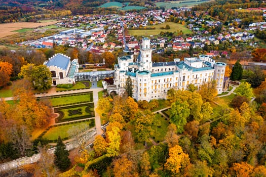 Castle Hluboka nad Vltavou is one of the most beautiful castles in Czech Republic. Castle Hluboka nad Vltavou in autumn with red foliage, Czechia. Colorful autumn view of Hluboka nad Vltavou castle.