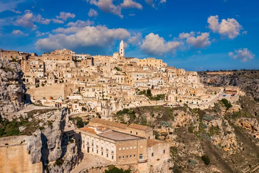 Panoramic view of the ancient town of Matera (Sassi di Matera) in a beautiful autumn day, Basilicata, southern Italy. Stunning view of the village of Matera. Matera is a city on a rocky outcrop.