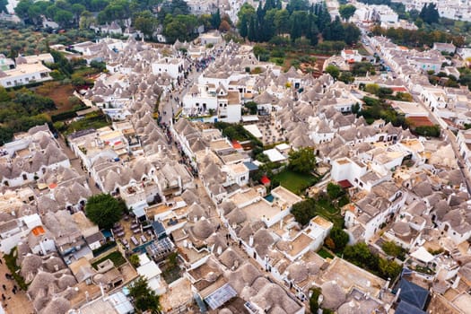The traditional Trulli houses in Alberobello city, Apulia, Italy. Cityscape over the traditional roofs of the Trulli, original and old houses of this region, Apulia, Alberobello, Puglia, Italy. 
