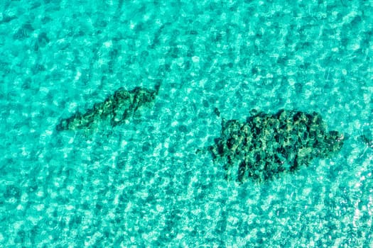 Calm Clear Sea Water Background. Calm Sea Water Background. Aerial footage of a perfectly crystal clear blue turquoise water. Top view of crystal clear blue water surface.