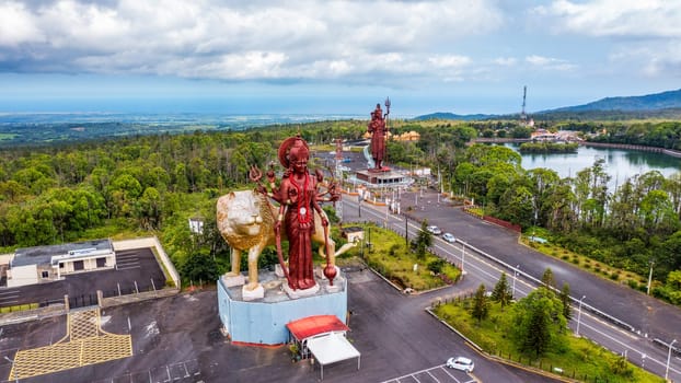 A powerful Statue of the Hindu goddess Durga Maa with a golden lion in sacred Ganga Talao. Shiva statue at Grand Bassin temple, the world's tallest Shiva temple, it is 33 meters tall. Mauritius